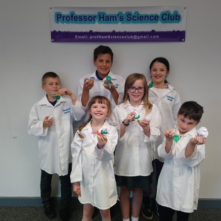 KID DISPLAYING WHAT THEY HEVE DONE AT PROFESSOR HAM'S SCIENCE CLUB